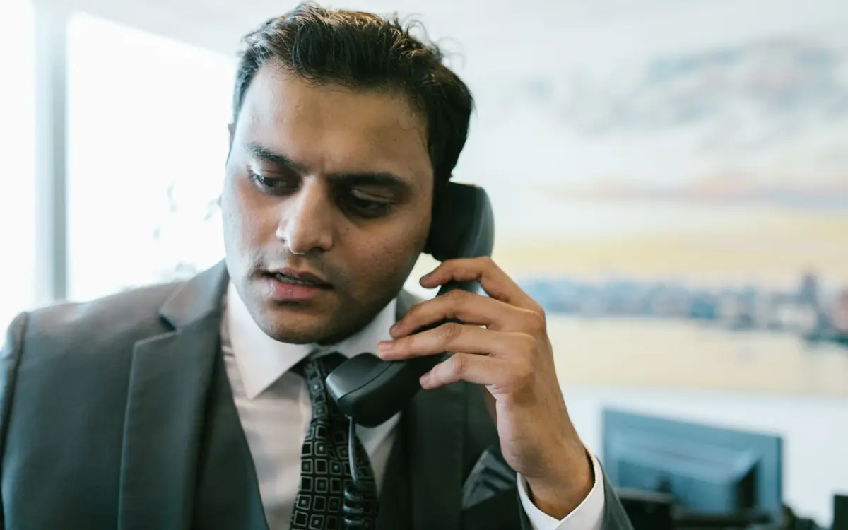 Business owner taking a customer call, the kind of enquiry Google Ads brings from people already searching